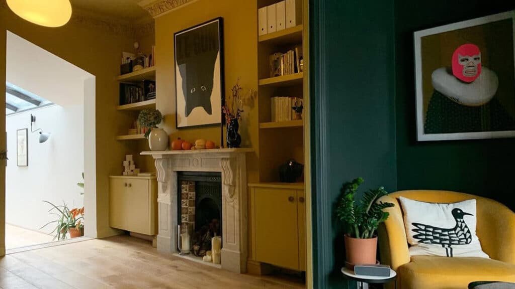 a chic living room painted in little greene bassoon and obsidian green