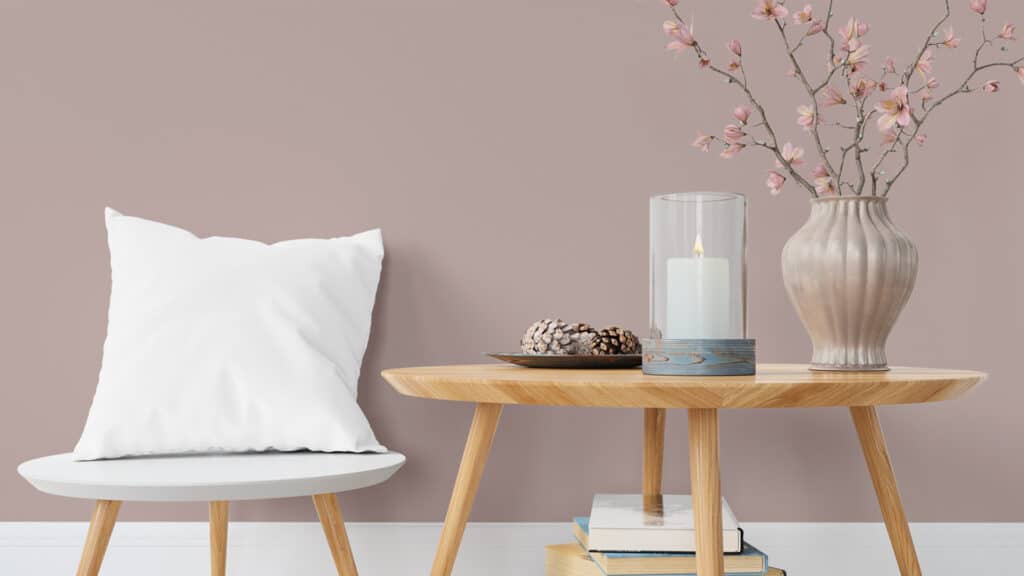 sulking room pink bedroom ideas with a decorated coffee table against a painted wall
